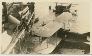 Image of Two navy planes on water by SS Peary