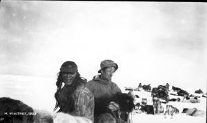Image of Eiseeyou and the author with baby musk-ox in his arm
