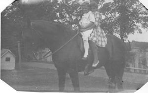Image of Miriam and Laura Look on horse
