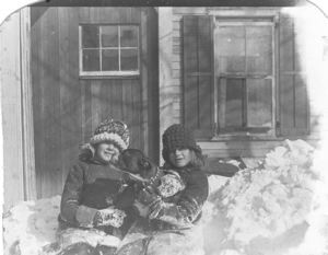 Image of Cousin Margaret and Miriam Look with dog, in snow