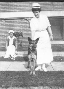 Image of "Miss La Voice [?], head nurse, my nurse, and the police dog"