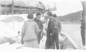 Image of ?, Donald MacMillan, and two crewmen on the Bowdoin