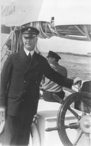 Image of Donald MacMillan at wheel before 17th expedition