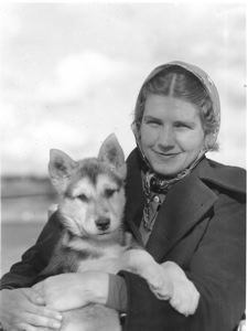 Image: Miriam MacMillan holding young dog (Probably Ahlningwah)