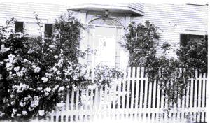 Image of Front door and roses at MacMillan home
