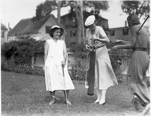 Image of ?, Amy Wood and Miriam MacMillan with golf clubs