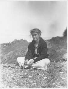 Image: Woman seated on grass