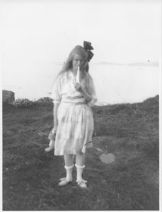 Image of Girl standing on grass