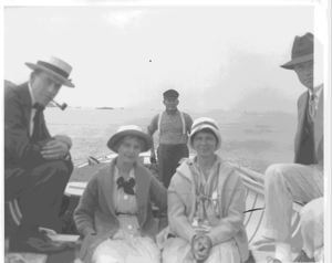 Image: 2 women and three men in open boat