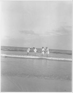 Image of 4 women wading