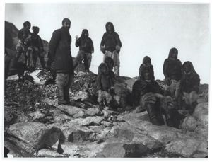 Image of Matthew Henson with Group of Inughuit on Rocks