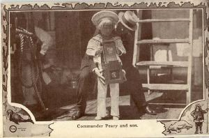 Image of Postcard: Commander Peary showing his Son [Robert, Jr.] a large camera