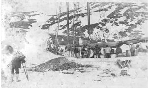Image of Photographer beside the Bowdoin in winter quarters - filming dancers on deck