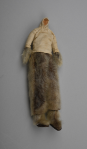 Image of Doll dressed in sealskin pants, white cotton parka