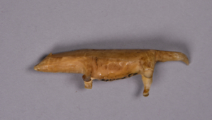 Image: Tired dog, carved ivory figure