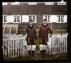 Image of Two Women in Greenlandic Dress in Front of Building