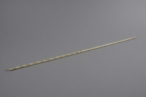 Image: whalebone rod with faint spiral design 