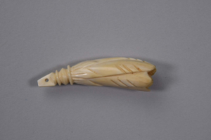 Image: ivory pendant carved into a flower blossom