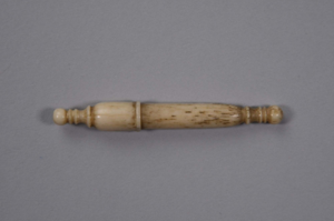 Image of ivory needle case, with screw-on top