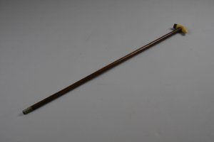 Image: walking stick with whale tooth handle, silver top and tooth end-cap, metal tip