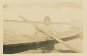 Image of Inuit woman in kayak