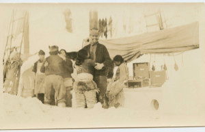 Image of Crew and Inuit women dancing aboard the Bowdoin to Brunswick record player. Rich