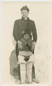 Image of Donald Mix and Inuit girl compare heights