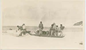 Image of Men with dory on snow; sledge and provisions