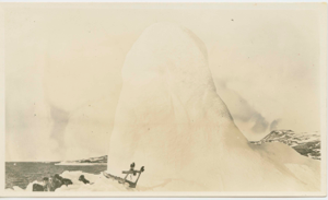 Image of Team at rest by iceberg. Mittens on upstanders