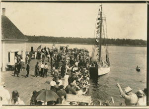 Image of The Bowdoin, dressed. Crowd on pier