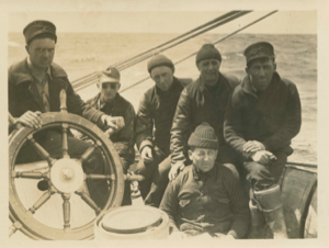 Image of Crew members by wheel. L>R: Richard Goddard John Jaynes, Donald Mix, Donald Mac