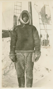 Image of Donald Mix in sheepskin jacket, on deck