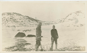 Image of Donald Mix and Richard Goddard in snow with shovels
