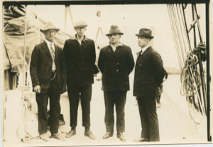 Image: Crew members on deck. L>R: Jot Small, ?, Thomas McCue, Donald MacMillan