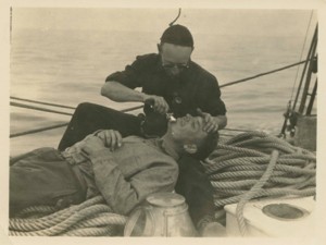 Image of Crew man shaving another