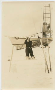 Image: Thomas McCue near iced-in Bowdoin, using theodolite [sextant]