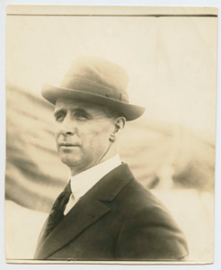 Image of Donald MacMillan in fedora, aboard