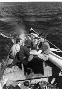 Image of John Huggins, Ira Best, George Spencer and Lloyd Moore on board the HOOD bound for Muskrat Fsalls