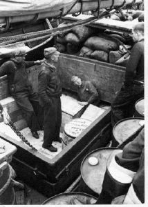 Image of Crew on deck with supplies