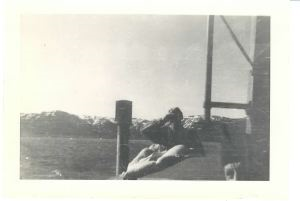 Image: Man with binoculars, on ship