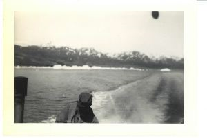 Image of Wake of boat; man in lower foreground