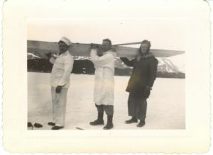 Image of Three servicemen ( Sgt. Parker in center) with kayak on their shoulders