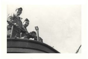 Image of Three men on deck