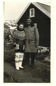 Image: Greenlandic woman in traditional dress, with serviceman
