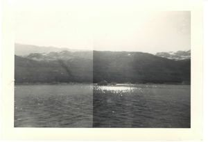 Image of Mountains, water, small icebergs along far shore