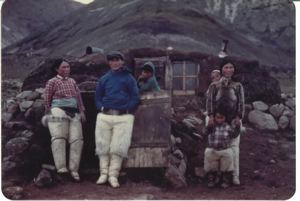 Image of Kali Peary, wife and others by stone/sod house