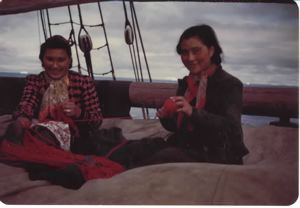 Image of Two Inuit women on schooner, winding yarn