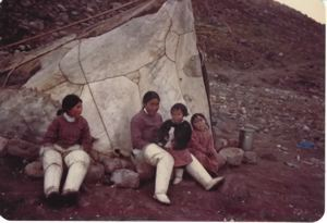 Image of Two Polar Inuit [Inughuit] women and two children seated by tupik