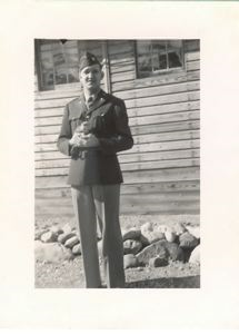 Image of Serviceman in dress uniform, holding Cheek