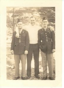 Image of Rutledge with two officers in dress uniform